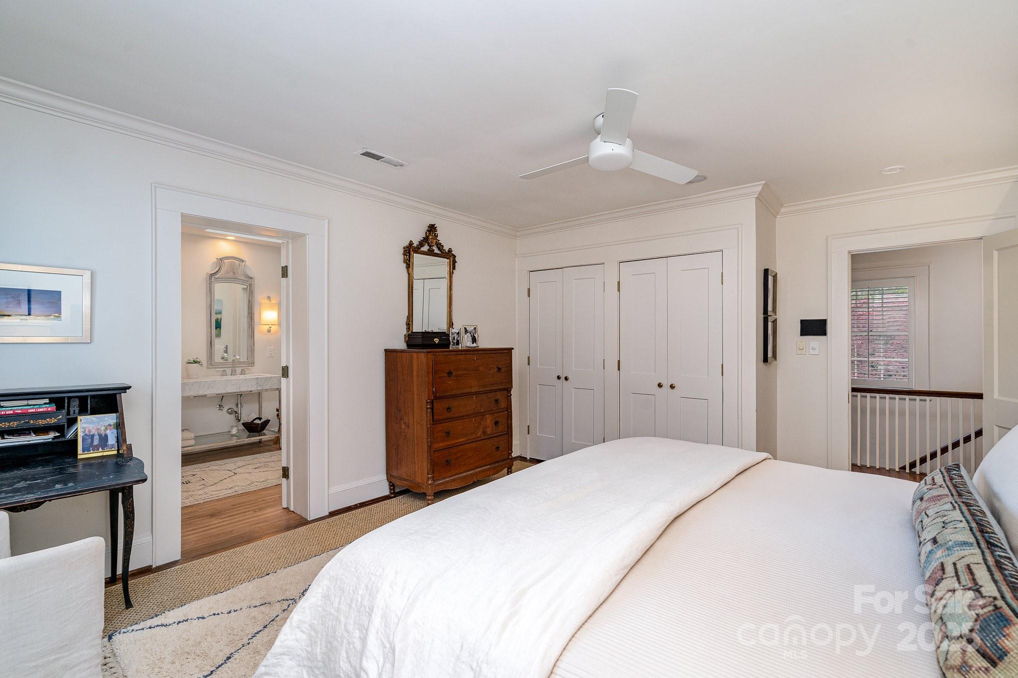 2120 Malvern Road Charlotte, NC 28207 - Photo 21 of 48 a bedroom with a large bed and dresser