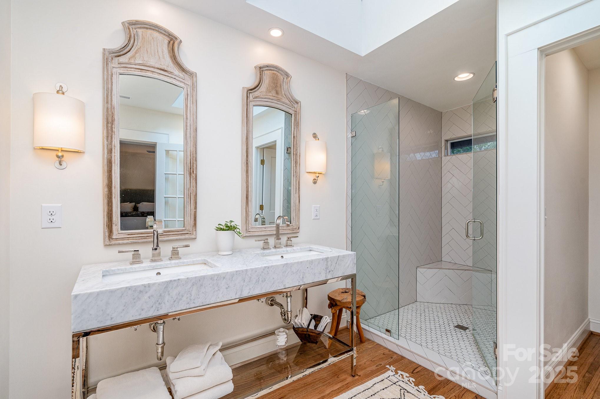 2120 Malvern Road Charlotte, NC 28207 - Photo 22 of 48 a bathroom with a granite countertop sink a toilet a mirror and shower