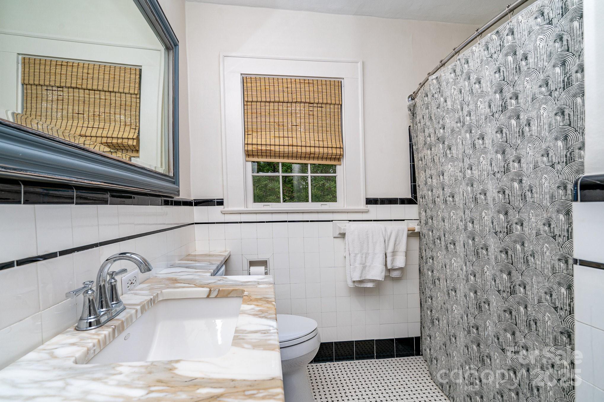 2120 Malvern Road Charlotte, NC 28207 - Photo 24 of 48 a bathroom with a sink and a shower