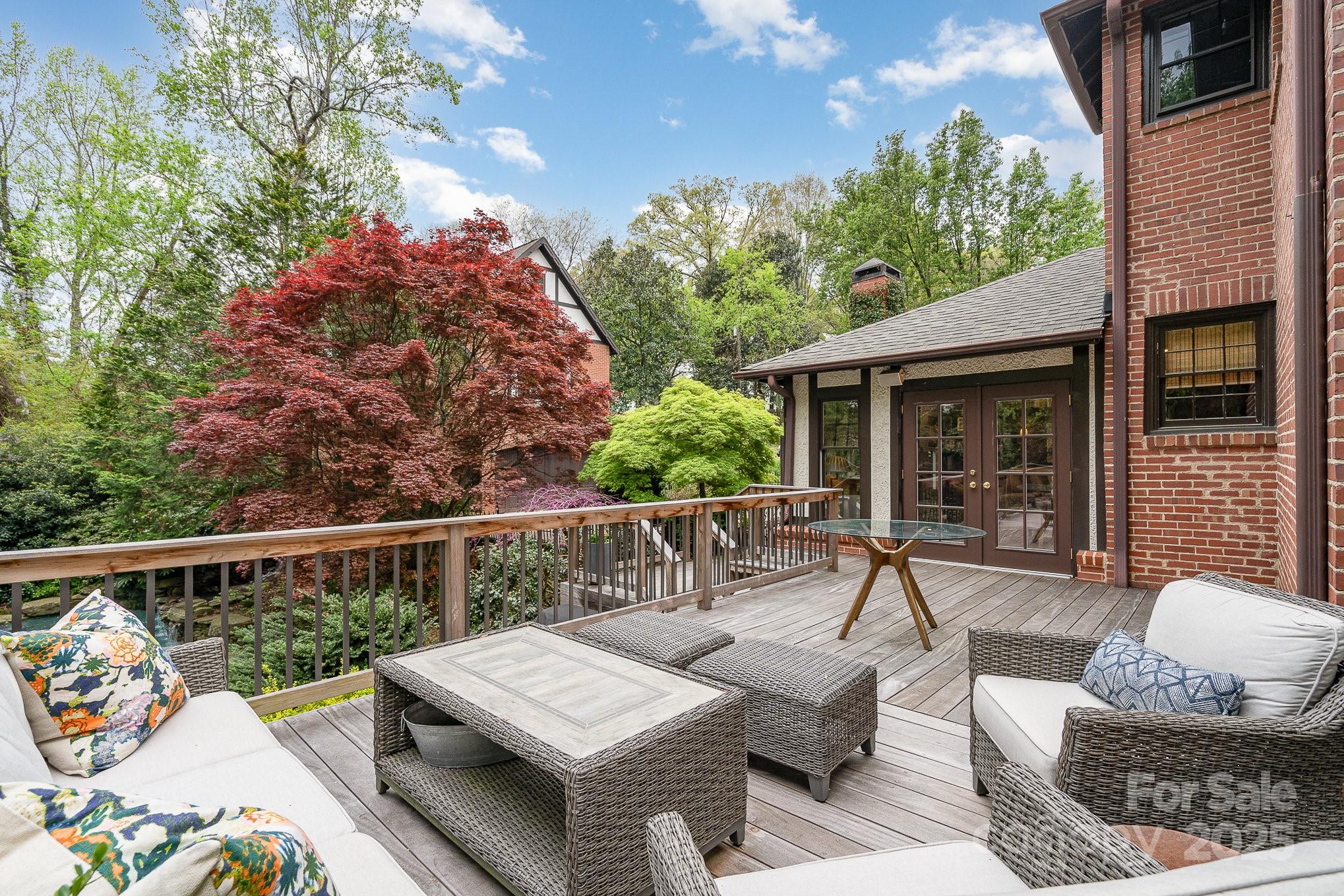 2120 Malvern Road Charlotte, NC 28207 - Photo 28 of 48 a view of a patio with couches table and chairs and potted plants