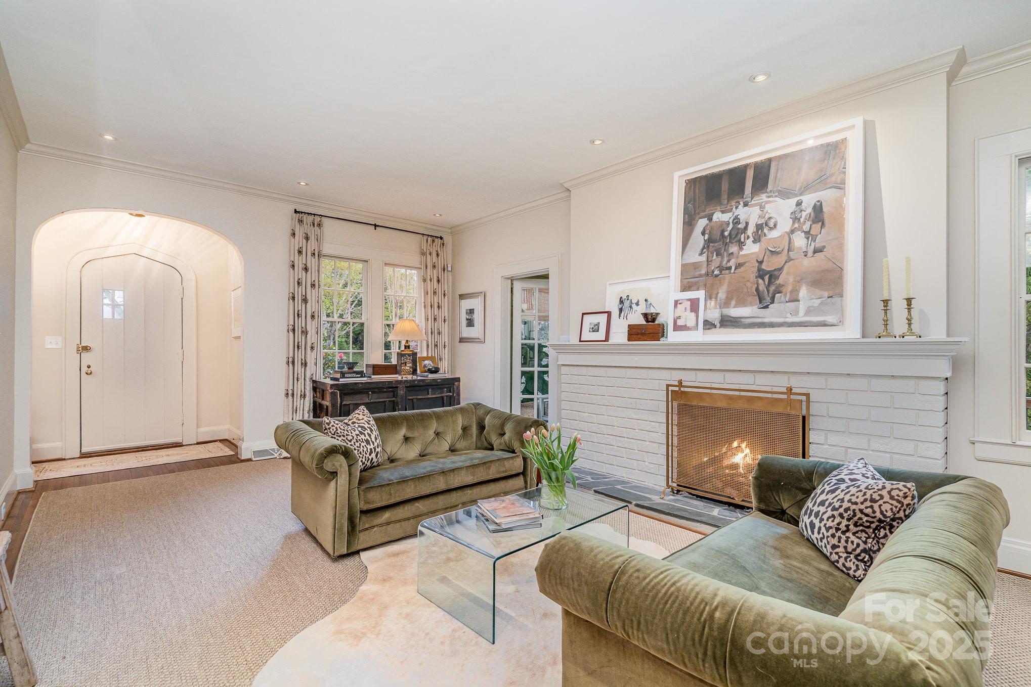 2120 Malvern Road Charlotte, NC 28207 - Photo 3 of 48 a living room with furniture and a fireplace