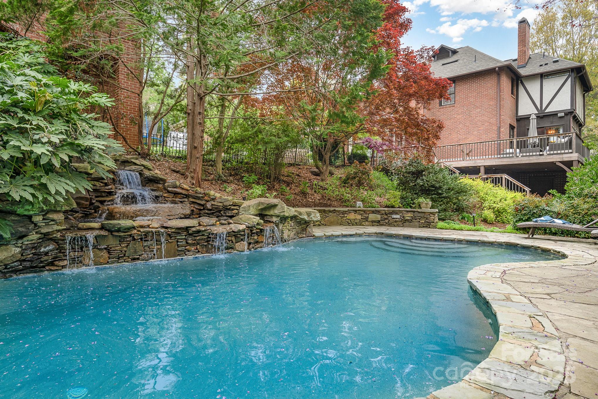 2120 Malvern Road Charlotte, NC 28207 - Photo 34 of 48 a view of swimming pool with lawn chairs and plants