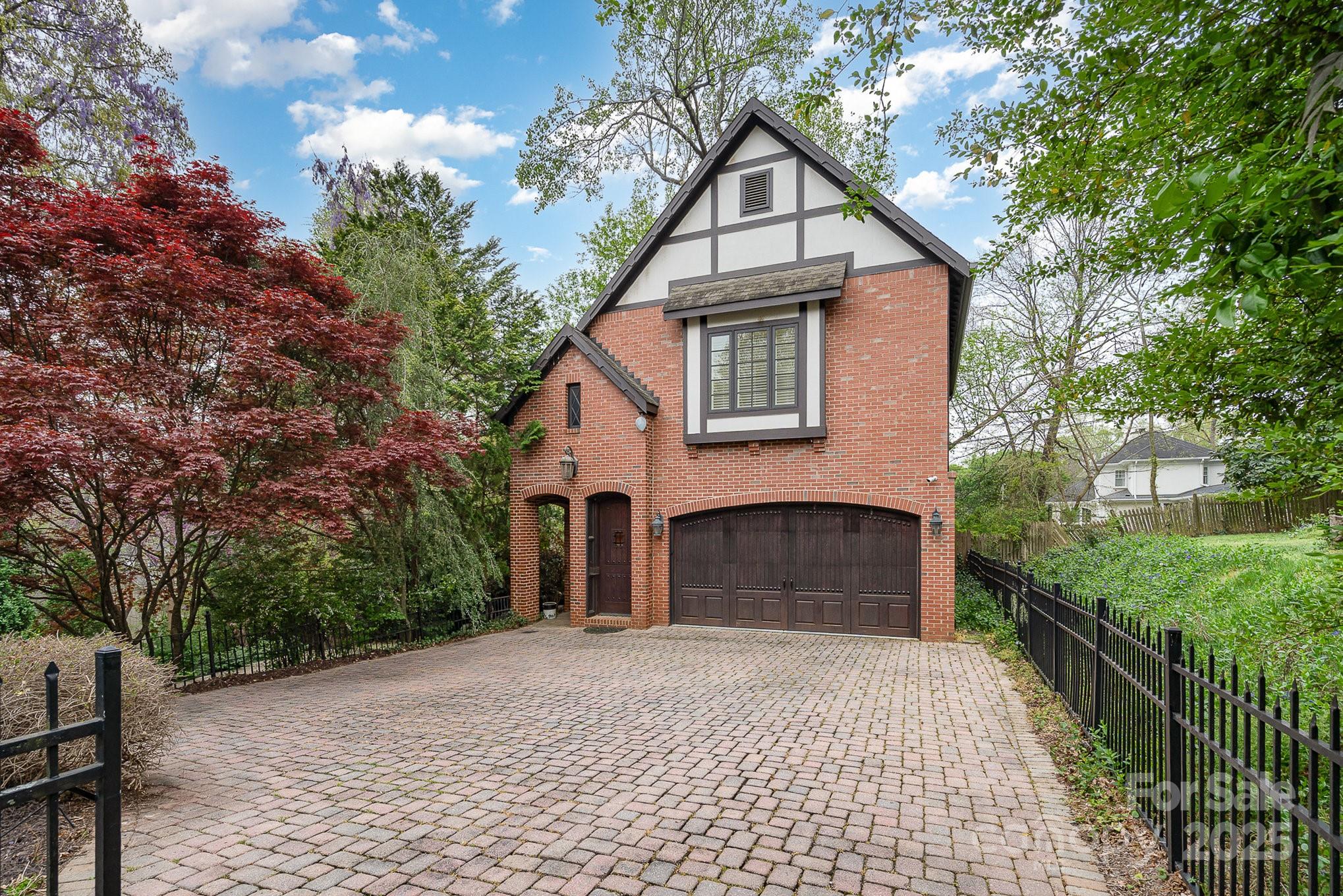 2120 Malvern Road Charlotte, NC 28207 - Photo 36 of 48 a front view of a house with a yard and garage
