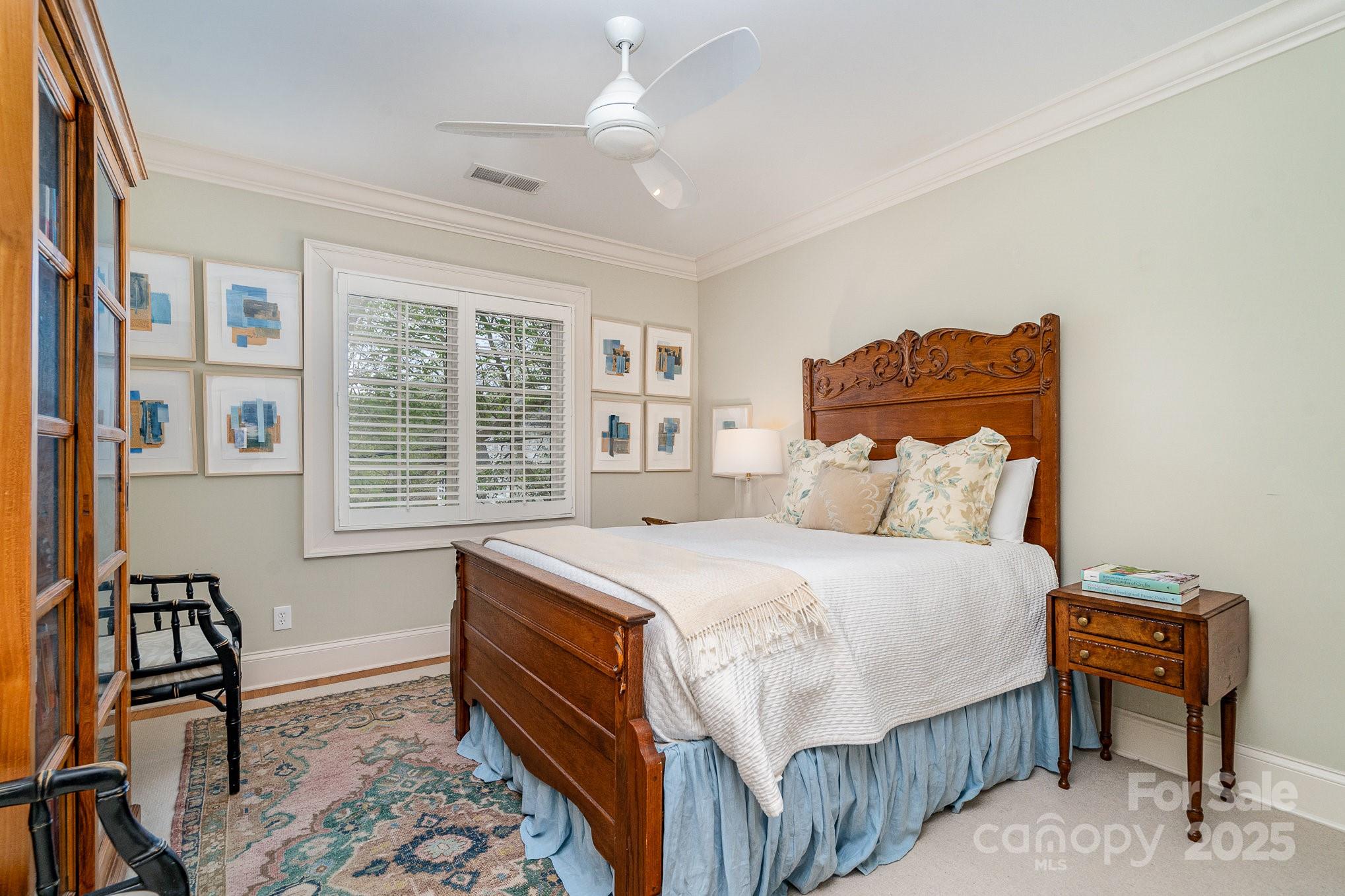 2120 Malvern Road Charlotte, NC 28207 - Photo 40 of 48 a bedroom with a bed and a window