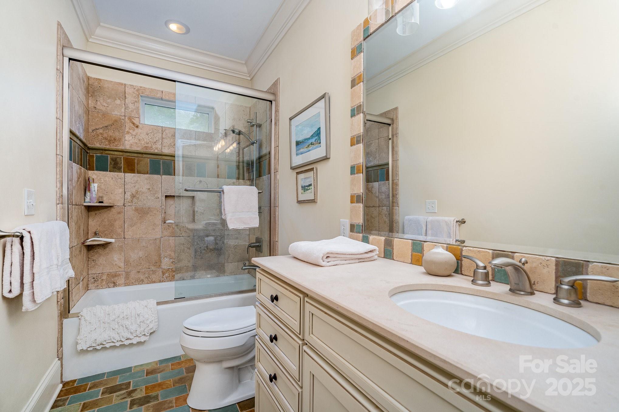 2120 Malvern Road Charlotte, NC 28207 - Photo 41 of 48 a bathroom with a granite countertop sink mirror toilet and shower