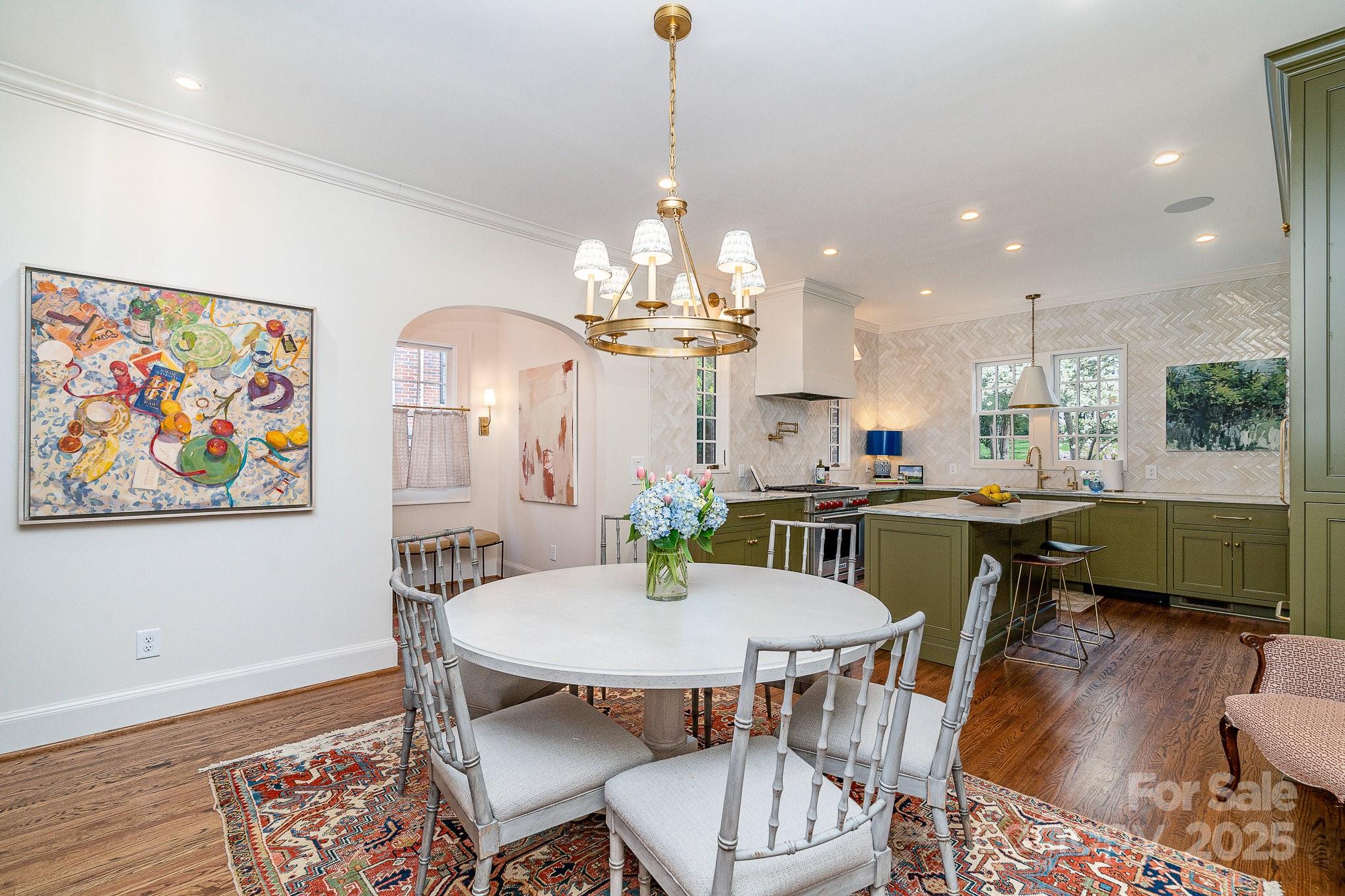 2120 Malvern Road Charlotte, NC 28207 - Photo 7 of 48 a dining room with furniture a rug and wooden floor