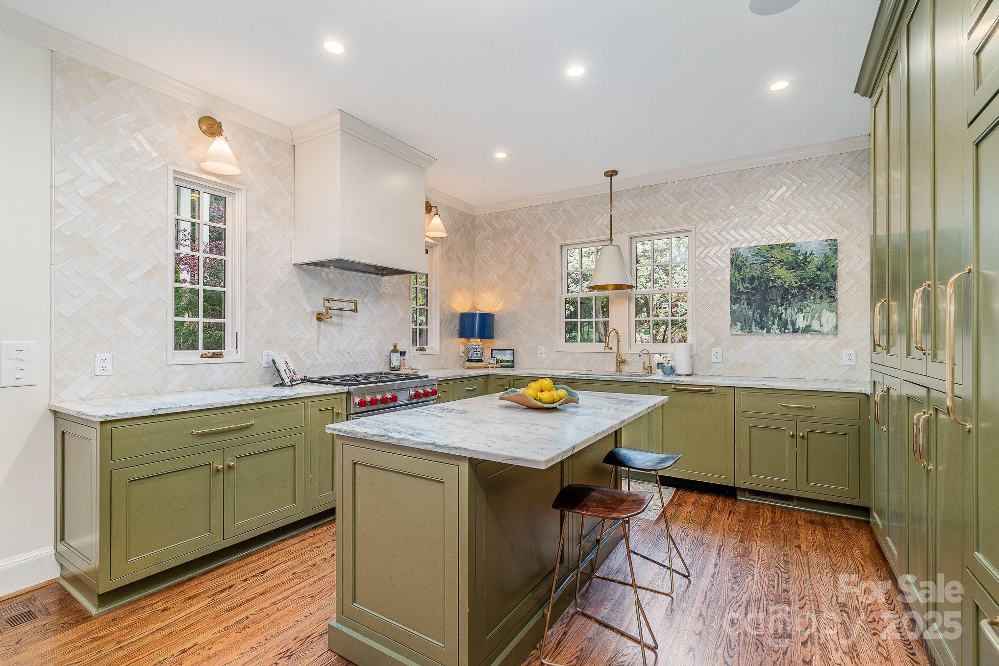 2120 Malvern Road Charlotte, NC 28207 - Photo 8 of 48 a kitchen with a stove a sink and a refrigerator