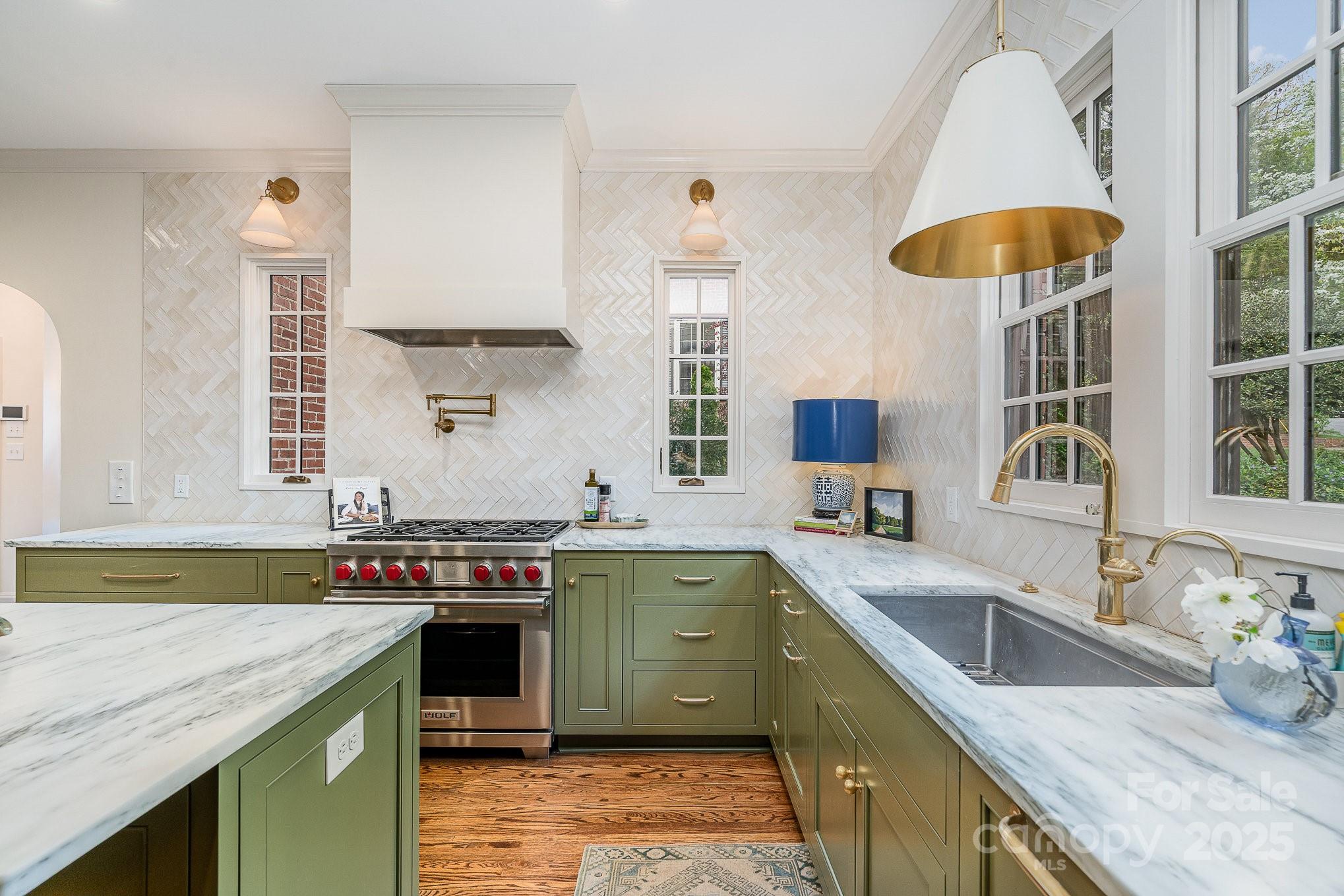 2120 Malvern Road Charlotte, NC 28207 - Photo 9 of 48 a kitchen with a sink and a stove