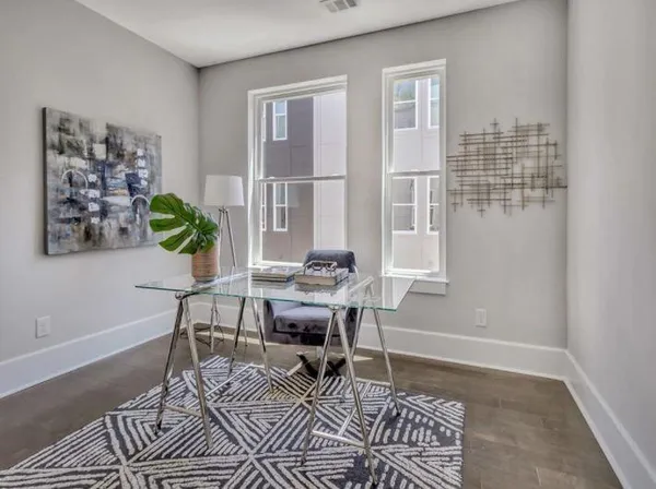 a workspace with furniture and window