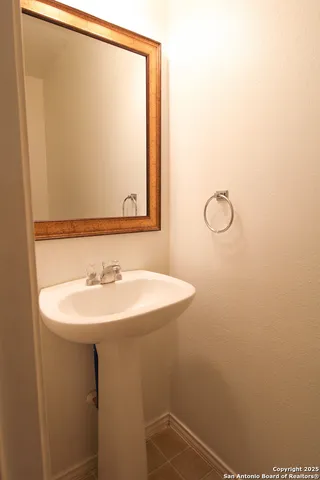 a bathroom with a sink and mirror