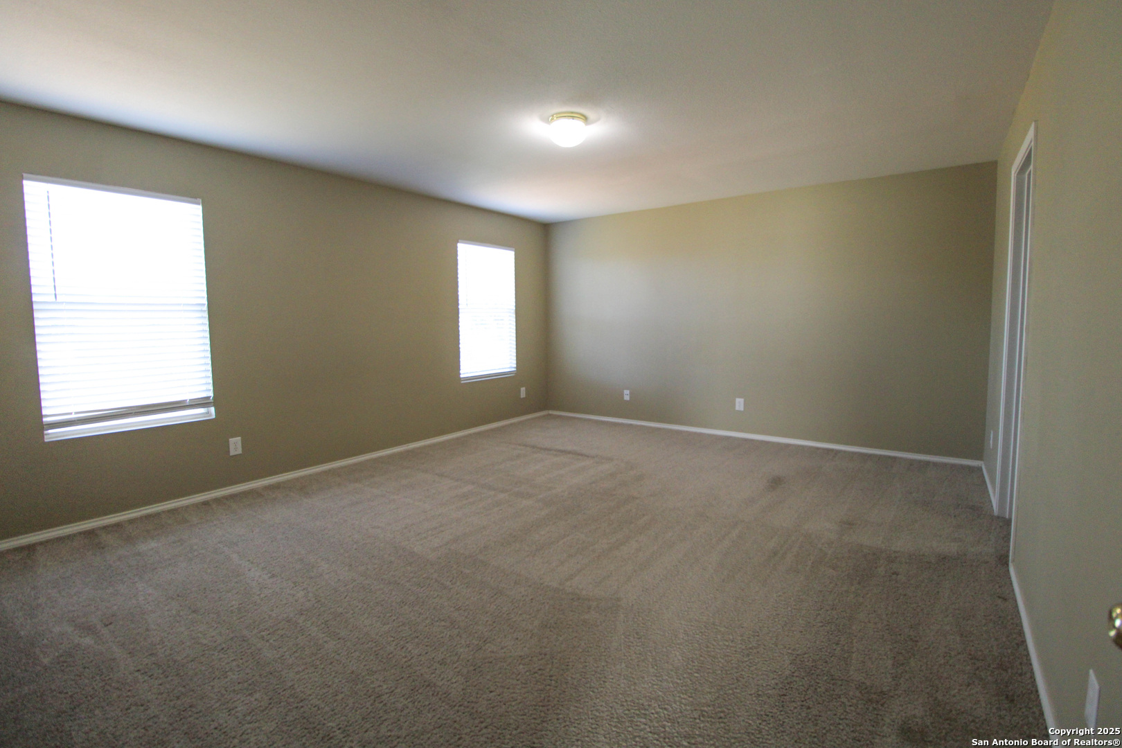 20823 Blue Trinity San Antonio, TX 78259 - Photo 16 of 46 an empty room with windows