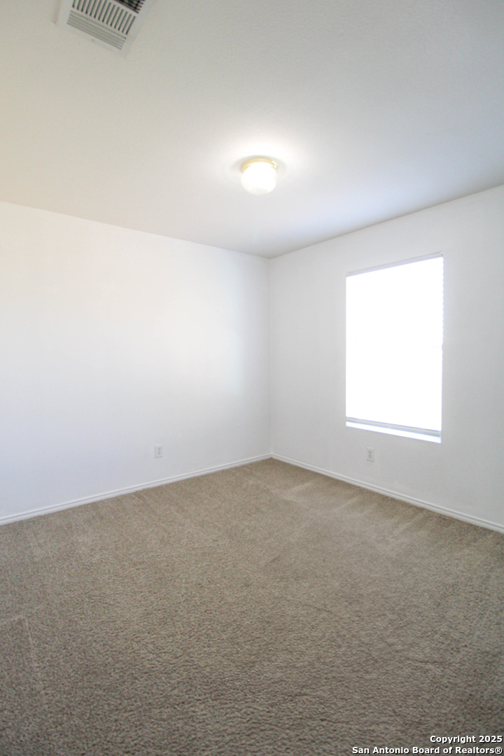 20823 Blue Trinity San Antonio, TX 78259 - Photo 28 of 46 an empty room with a window
