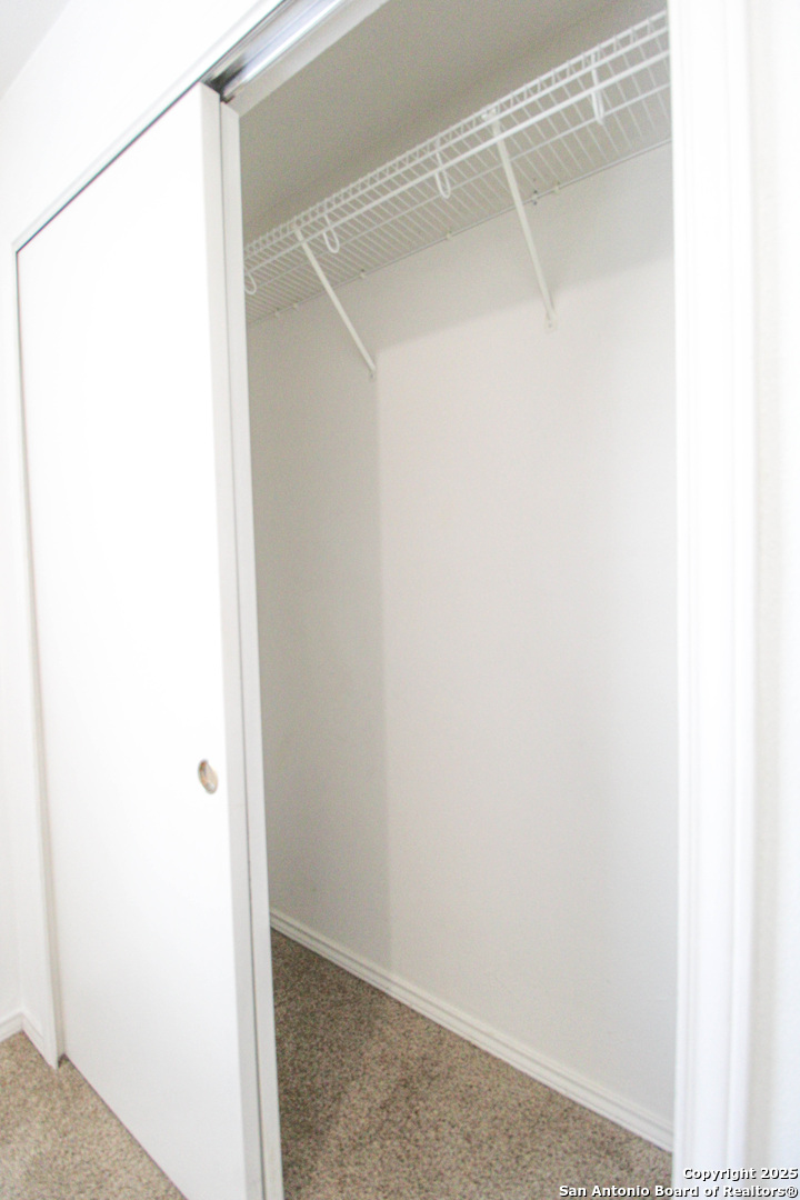 20823 Blue Trinity San Antonio, TX 78259 - Photo 32 of 46 a bathroom with a glass shower door