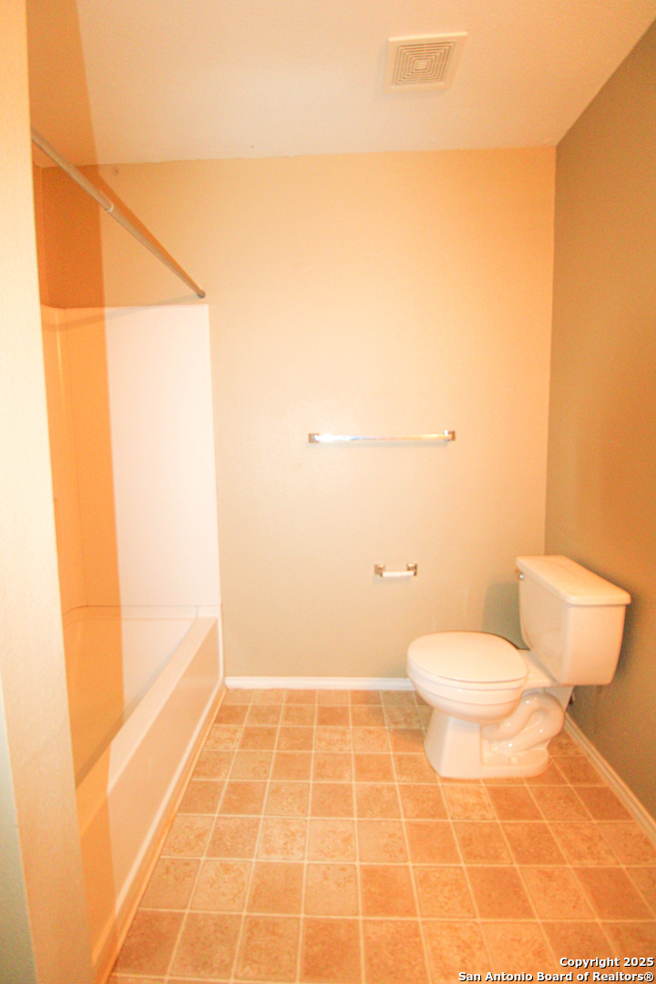 20823 Blue Trinity San Antonio, TX 78259 - Photo 43 of 46 a bathroom with a toilet and a shower