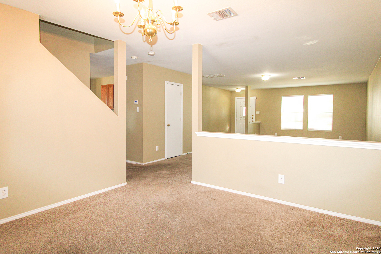 20823 Blue Trinity San Antonio, TX 78259 - Photo 6 of 46 a view of a hallway with a chandelier