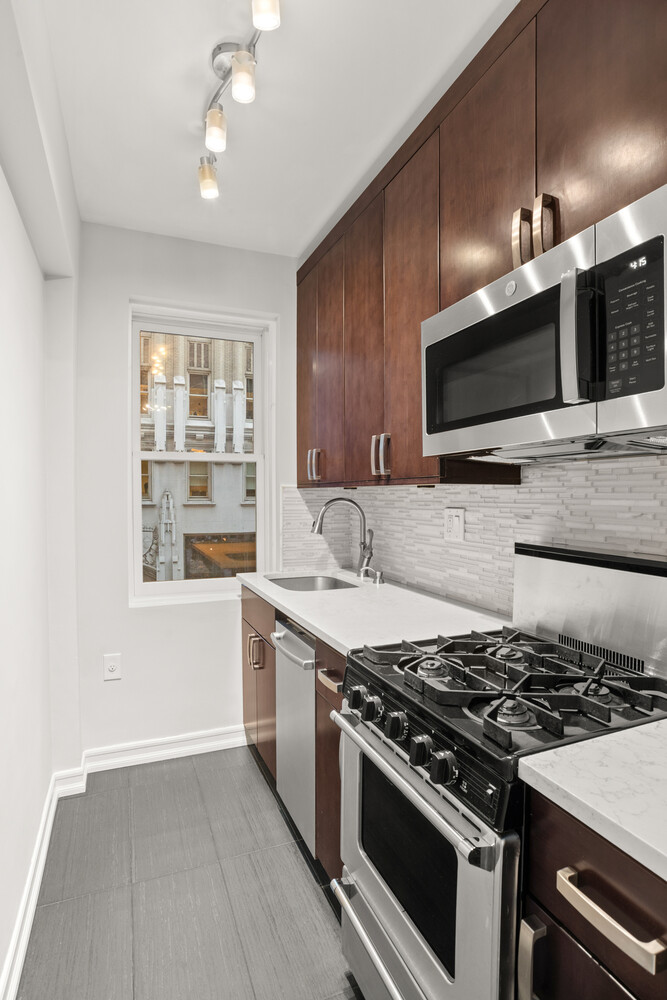 220 Madison Avenue, Unit 3M Manhattan, NY 10016 - Photo 5 of 11 a kitchen with a stove and a sink