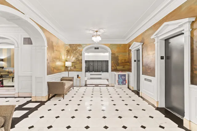 a bathroom with a double vanity sink toilet and shower
