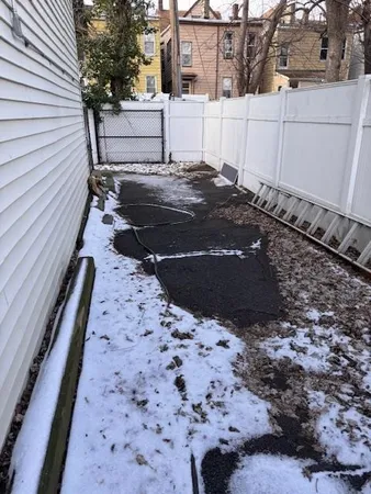 a view of a backyard of the house