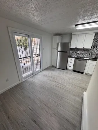 a view of an empty room with a window