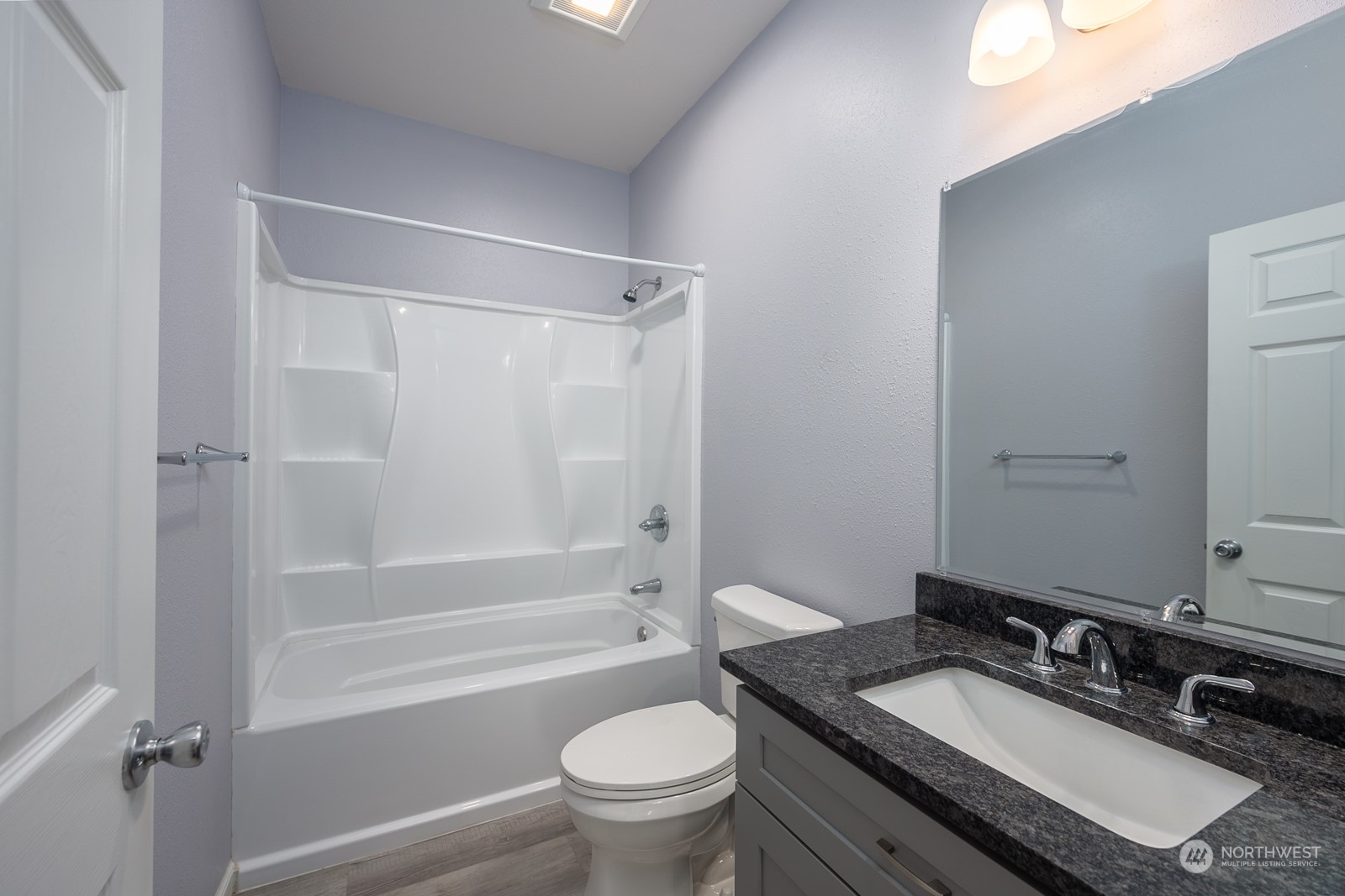 481 Patrick Road Ephrata, WA 98823 - Photo 25 of 39 a bathroom with a granite countertop sink toilet a mirror and shower