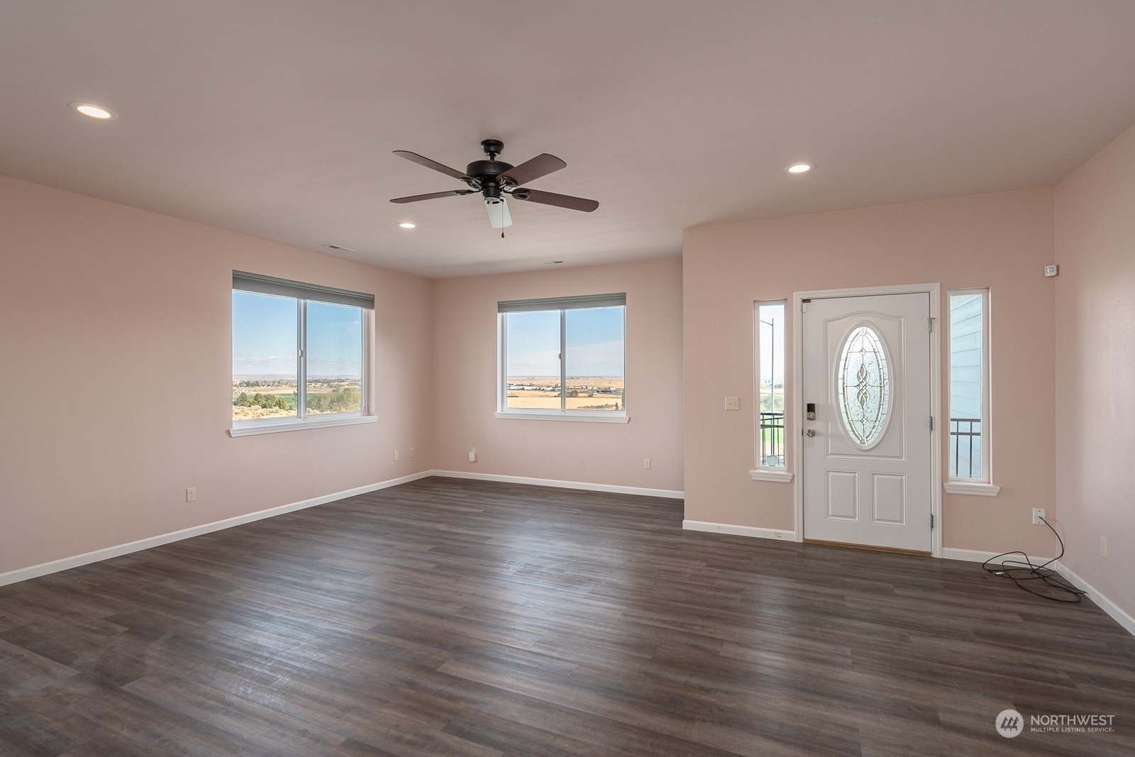 481 Patrick Road Ephrata, WA 98823 - Photo 8 of 39 a view of an empty room with window and wooden floor