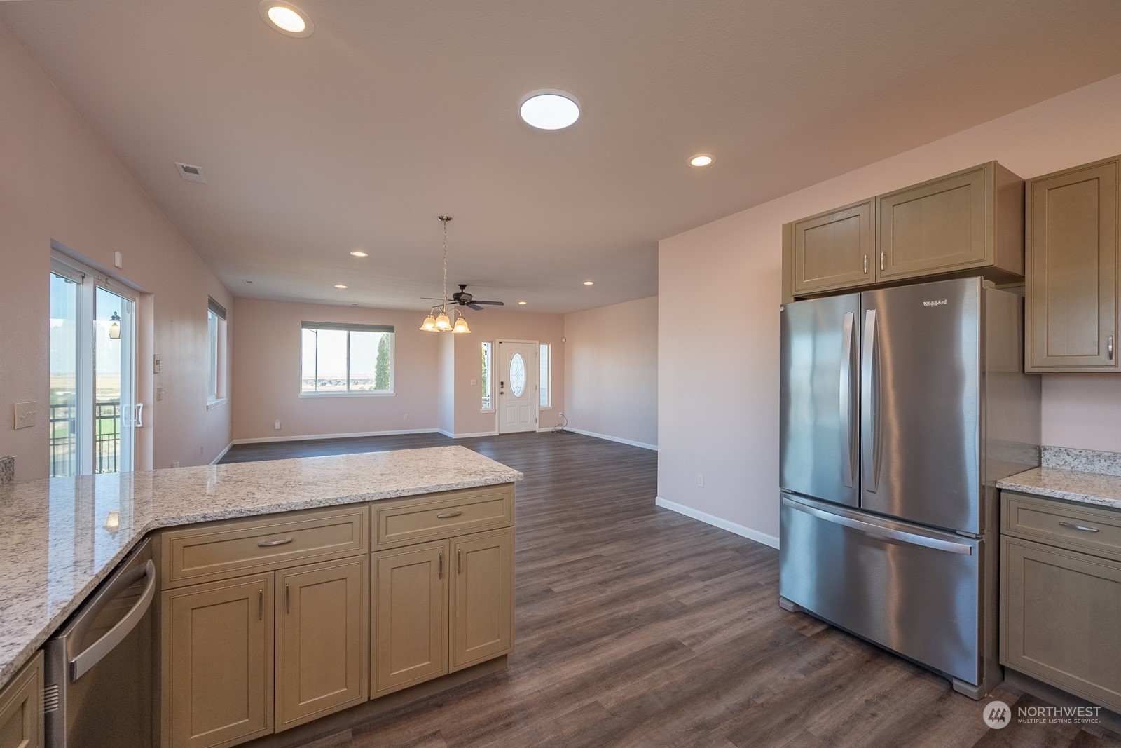 481 Patrick Road Ephrata, WA 98823 - Photo 9 of 39 a kitchen with kitchen island white cabinets and stainless steel appliances