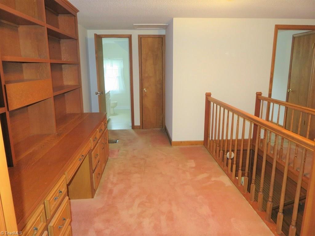4744 Germanton Road Winston-Salem, NC 27105 - Photo 12 of 25 Office with built-in desk and bookshelves on 2nd level