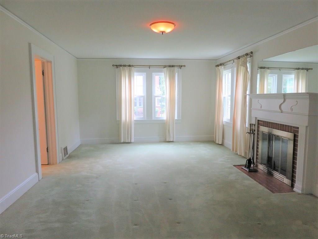 4744 Germanton Road Winston-Salem, NC 27105 - Photo 3 of 25 Large living room with woodburning fireplace - many rooms recently painted