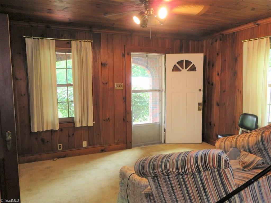 4744 Germanton Road Winston-Salem, NC 27105 - Photo 4 of 25 Cozy den with rich wood paneled walls and ceiling