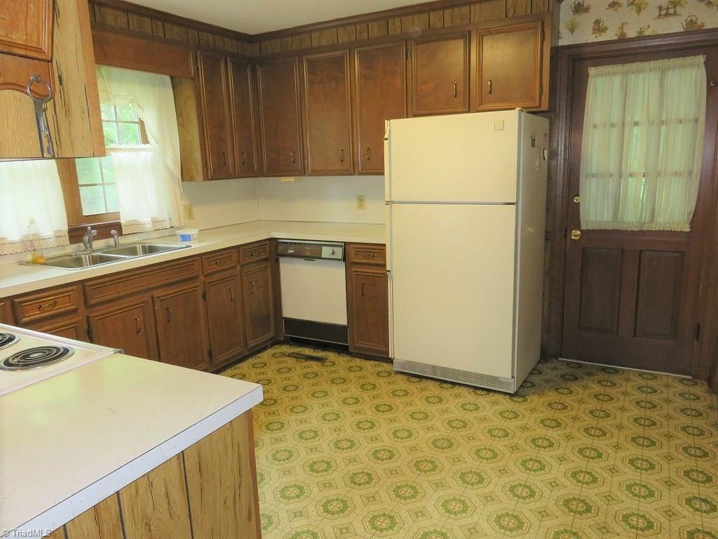 4744 Germanton Road Winston-Salem, NC 27105 - Photo 6 of 25 Home so well maintained - door leads to large laundry porch which is heated/cooled