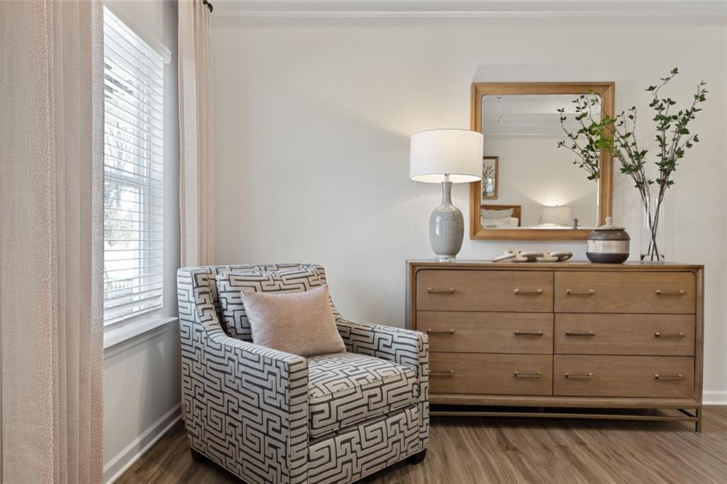 730 Sinclair Lane Temple, GA 30179 - Photo 32 of 37 a bedroom with a bed and a potted plant