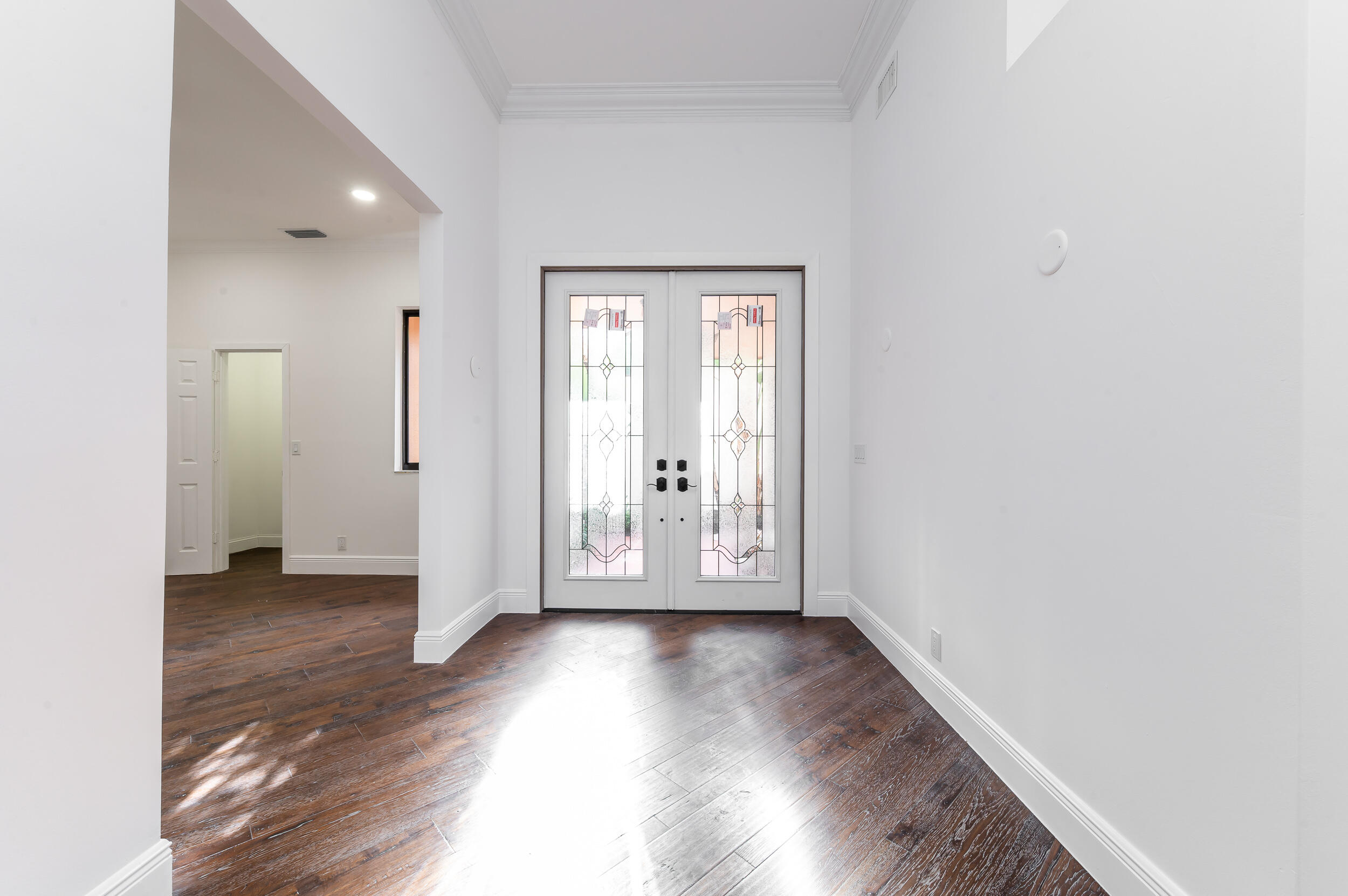 6388 Via Rosa Boca Raton, FL 33433 - Photo 18 of 49 an empty room with wooden floor and a window