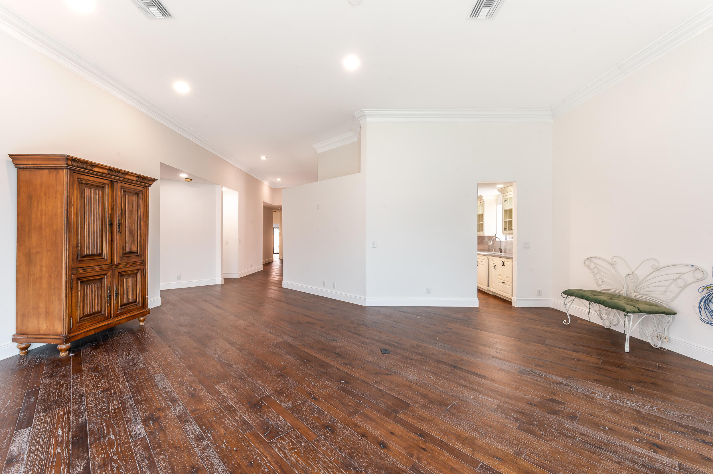 6388 Via Rosa Boca Raton, FL 33433 - Photo 28 of 49 a view of an empty room with wooden floor and a window