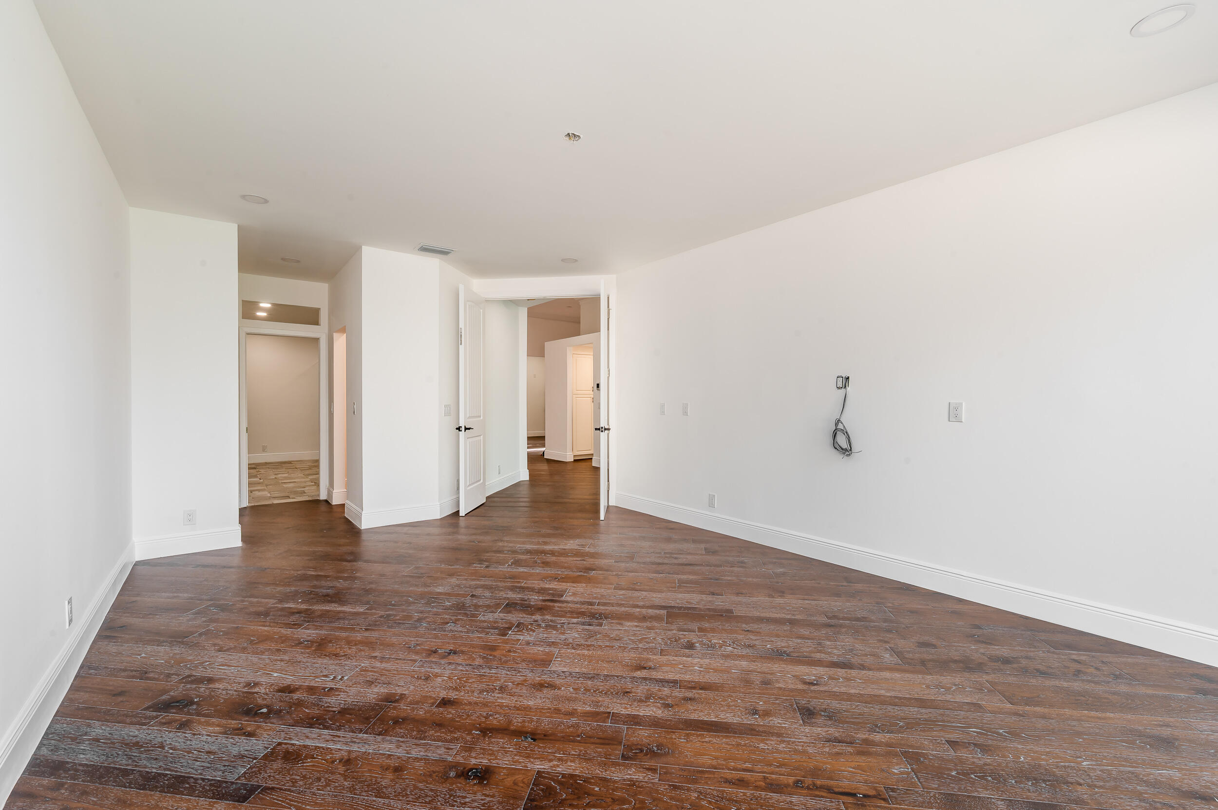 6388 Via Rosa Boca Raton, FL 33433 - Photo 32 of 49 a view of an empty room and wooden floor