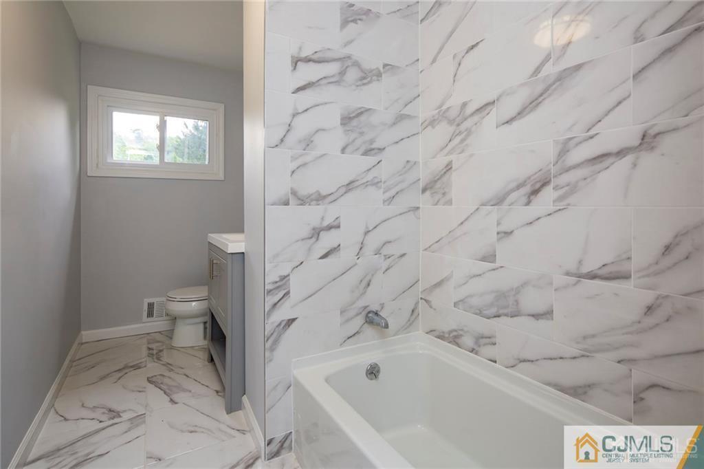 26 Purdue Road Old Bridge, NJ 08859 - Photo 11 of 21 a bathroom with a bathtub and toilet