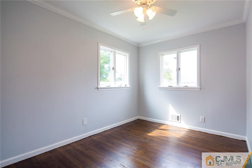 26 Purdue Road Old Bridge, NJ 08859 - Photo 15 of 21 a view of an empty room with wooden floor and a window