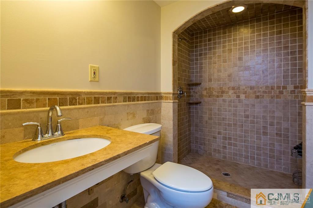 26 Purdue Road Old Bridge, NJ 08859 - Photo 19 of 21 a bathroom with a sink a toilet and shower