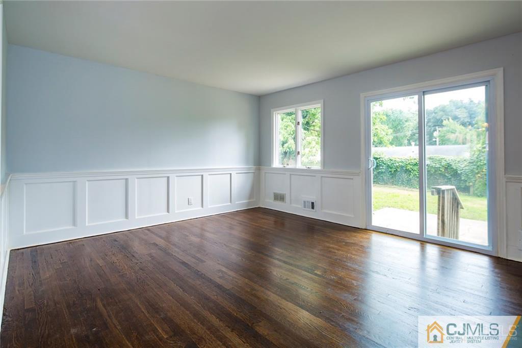 26 Purdue Road Old Bridge, NJ 08859 - Photo 7 of 21 a view of an empty room with wooden floor and a window