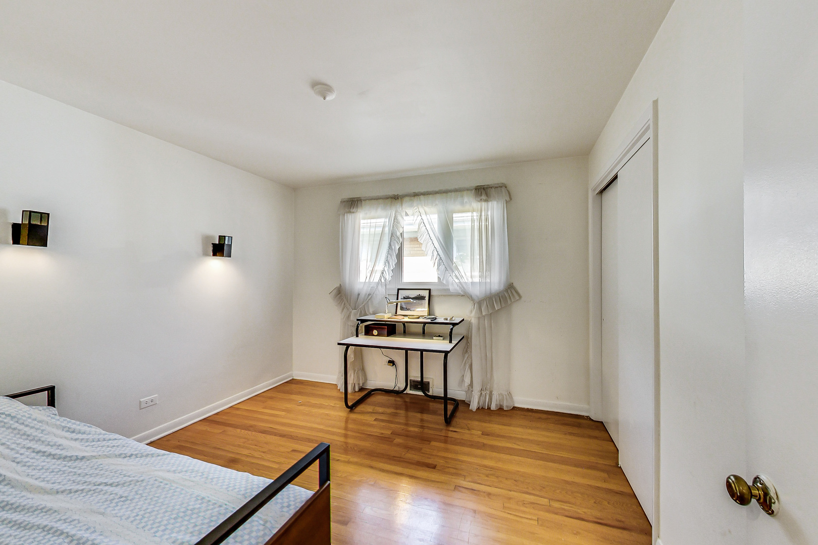 1604 Oakton Street Park Ridge, IL 60068 - Photo 13 of 23 a bedroom with a bed and a window