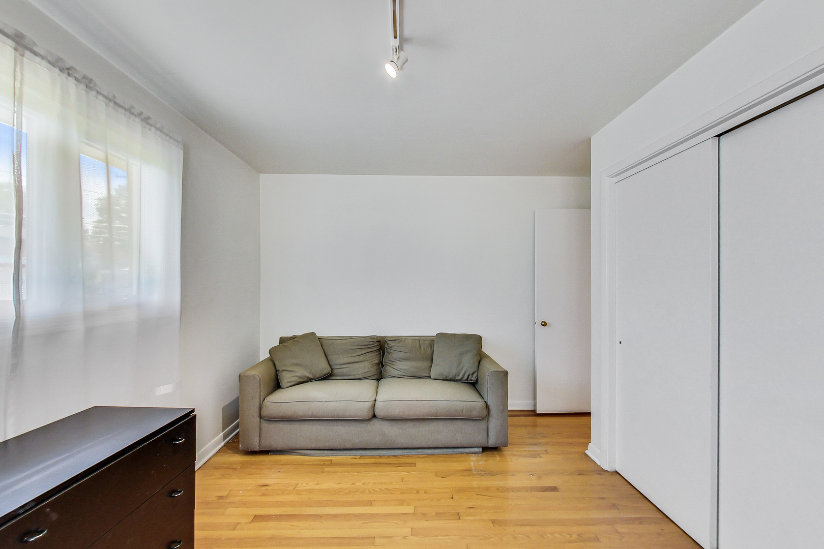 1604 Oakton Street Park Ridge, IL 60068 - Photo 15 of 23 a living room with furniture and a walk in closet