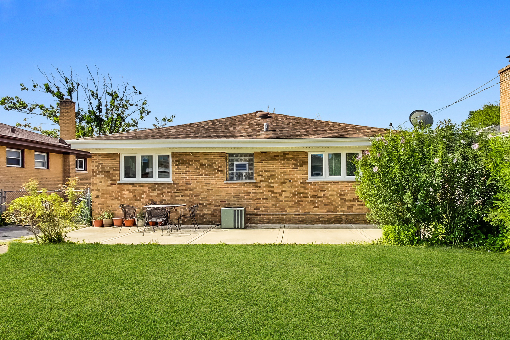 1604 Oakton Street Park Ridge, IL 60068 - Photo 20 of 23 a front view of a house with a yard