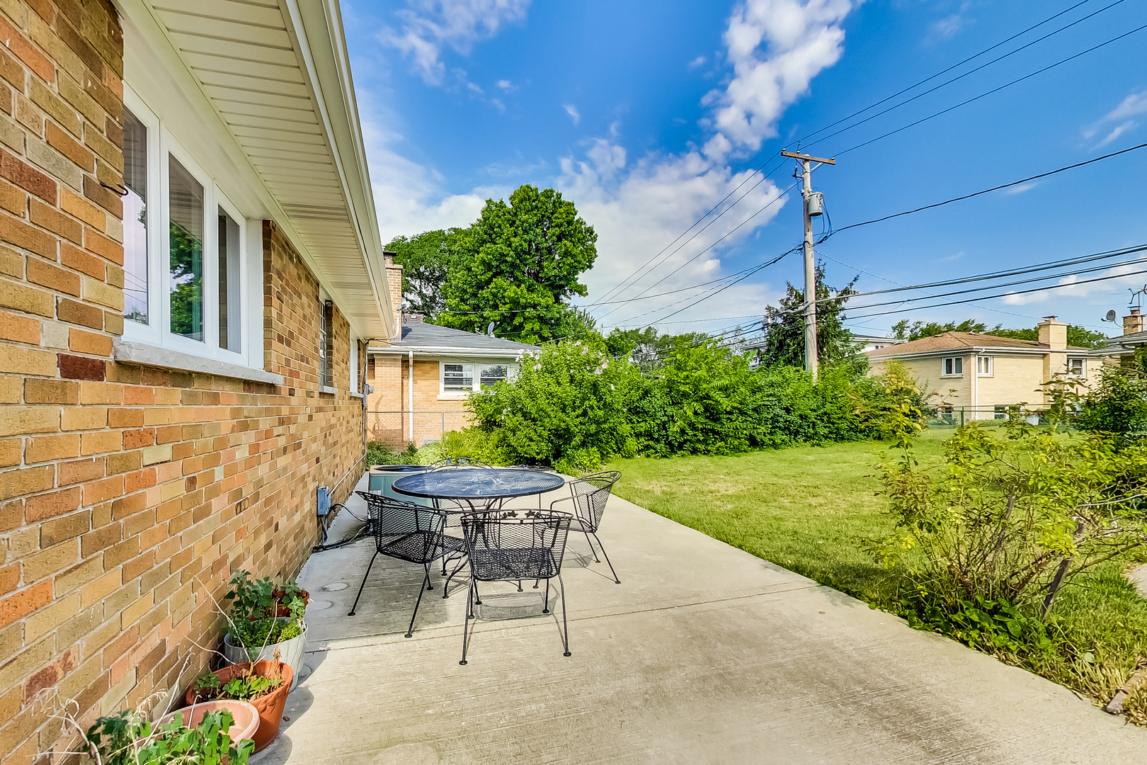 1604 Oakton Street Park Ridge, IL 60068 - Photo 22 of 23 a view of a patio with table and chairs and potted plants