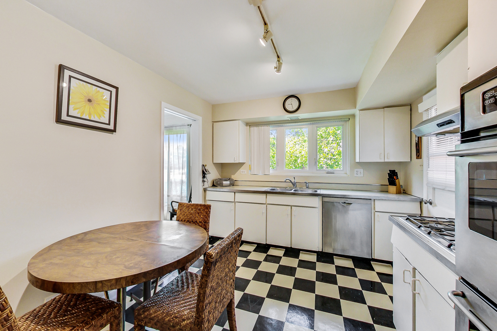 1604 Oakton Street Park Ridge, IL 60068 - Photo 7 of 23 a kitchen with granite countertop stainless steel appliances a sink and a stove