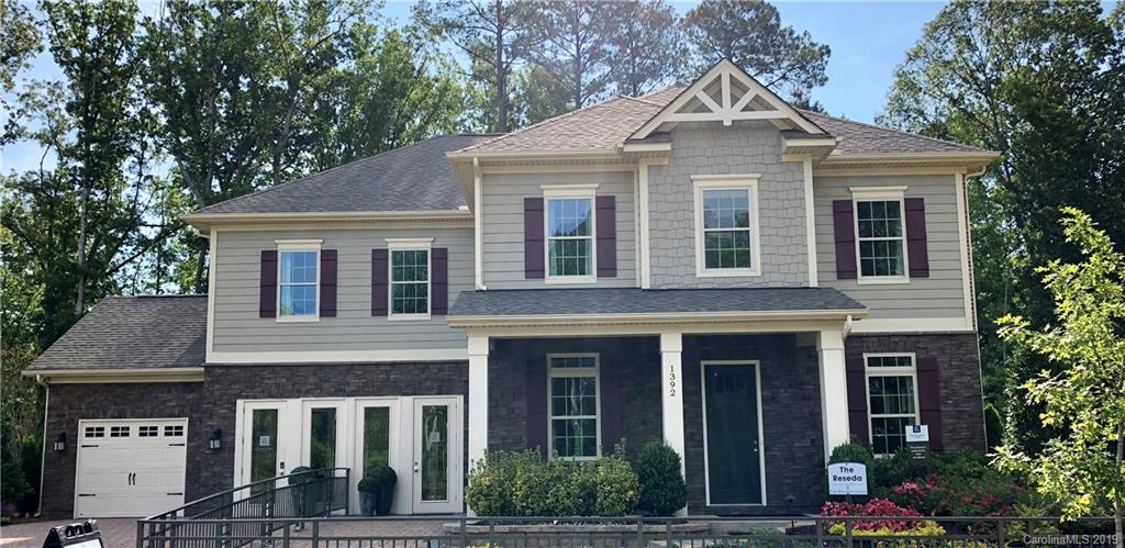 1392 Afton Way, Unit 147 Fort Mill, SC 29708 - Photo 1 of 28 a front view of a house with garden