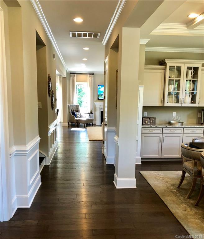 1392 Afton Way, Unit 147 Fort Mill, SC 29708 - Photo 2 of 28 a view of a living room kitchen and a wooden floor
