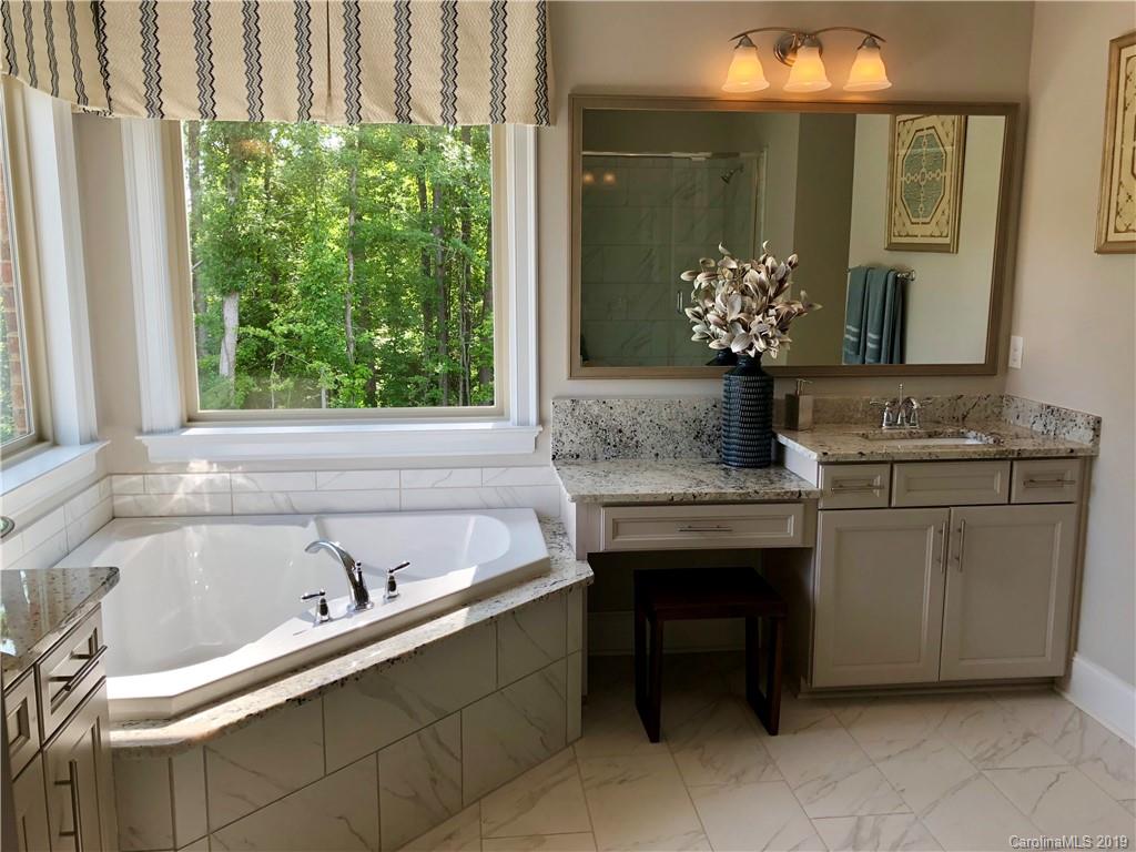 1392 Afton Way, Unit 147 Fort Mill, SC 29708 - Photo 18 of 28 a bathroom with a sink and a bathtub