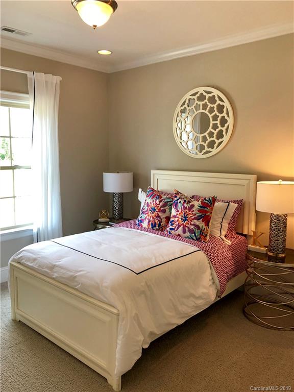 1392 Afton Way, Unit 147 Fort Mill, SC 29708 - Photo 23 of 28 a bedroom with a bed and a large window