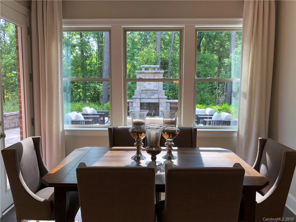 1392 Afton Way, Unit 147 Fort Mill, SC 29708 - Photo 27 of 28 a view of a dining room with furniture window and outside view