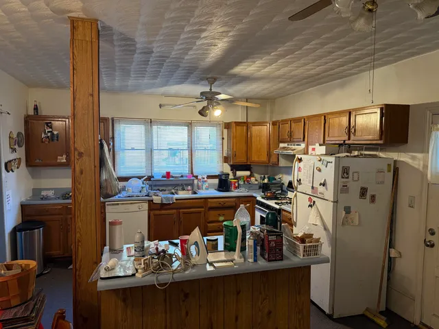 a kitchen with sink and cabinets