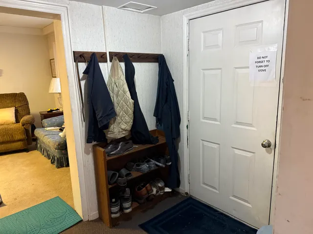 a bedroom with bed and a window